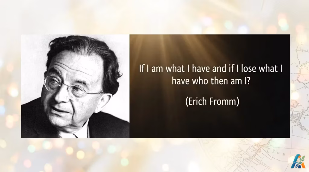 Foto hitam putih Erich Fromm di samping kutipan miliknya mengenai konsep "having vs being mode" dengan latar belakang estetik bercahaya.