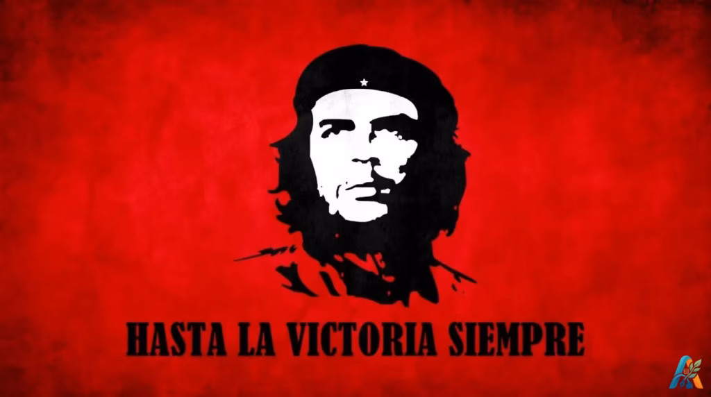 Foto hitam putih ikonik Che Guevara berlatar belakang merah bertuliskan Hasta La Victoria Siempre.