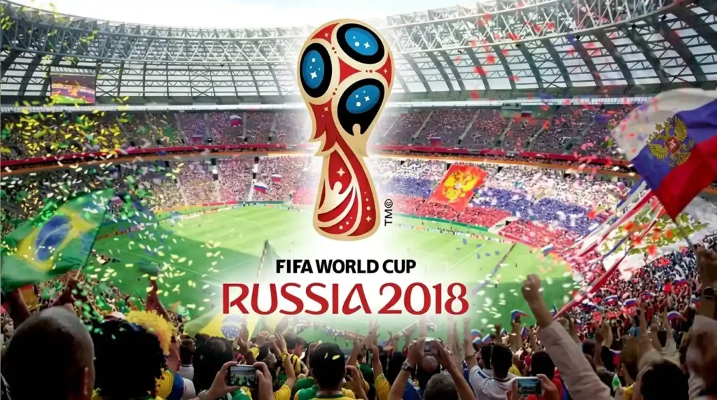 Logo resmi FIFA World Cup Russia 2018 berlatar belakang suasana kemeriahan suporter di dalam stadion sepak bola, dari file fifa-world-cup-russia-2018.webp