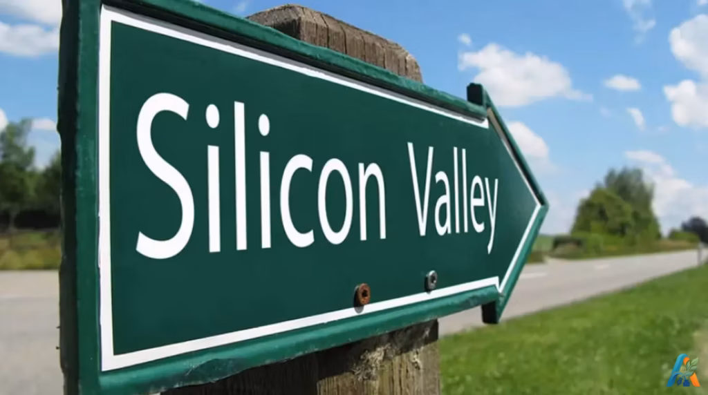 Papan penunjuk jalan berwarna hijau berbentuk panah dengan tulisan Silicon Valley di pinggir jalan